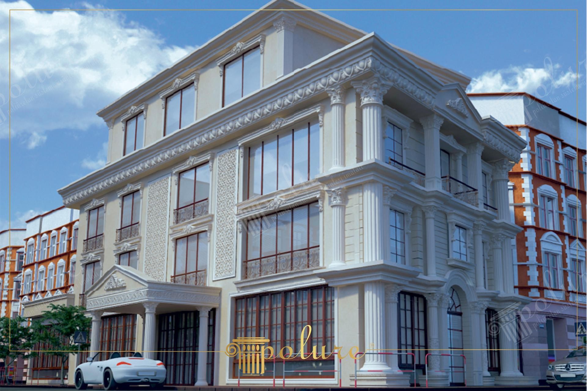 Dört katlı ve açık renkli bir binanın cephesinde kurgulanan beyaz pilaster sütunlar, taçlı pencere söveleri ve dikdörtgen duvar panelleri ile yaratılmış neoklasik tasarım.