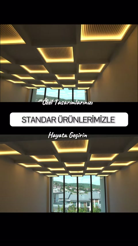 Sıcak ışıklı dikdörtgen tavan armatürleri mekân boyunca uzanıyor